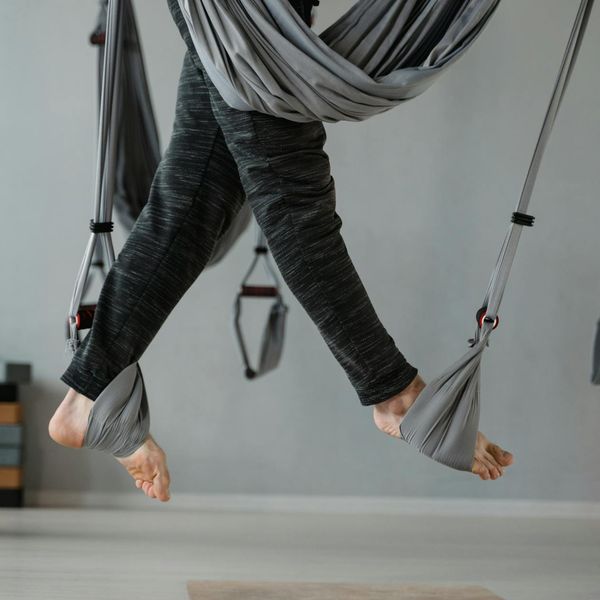 Person meditating peacefully in a calm, modern environment.